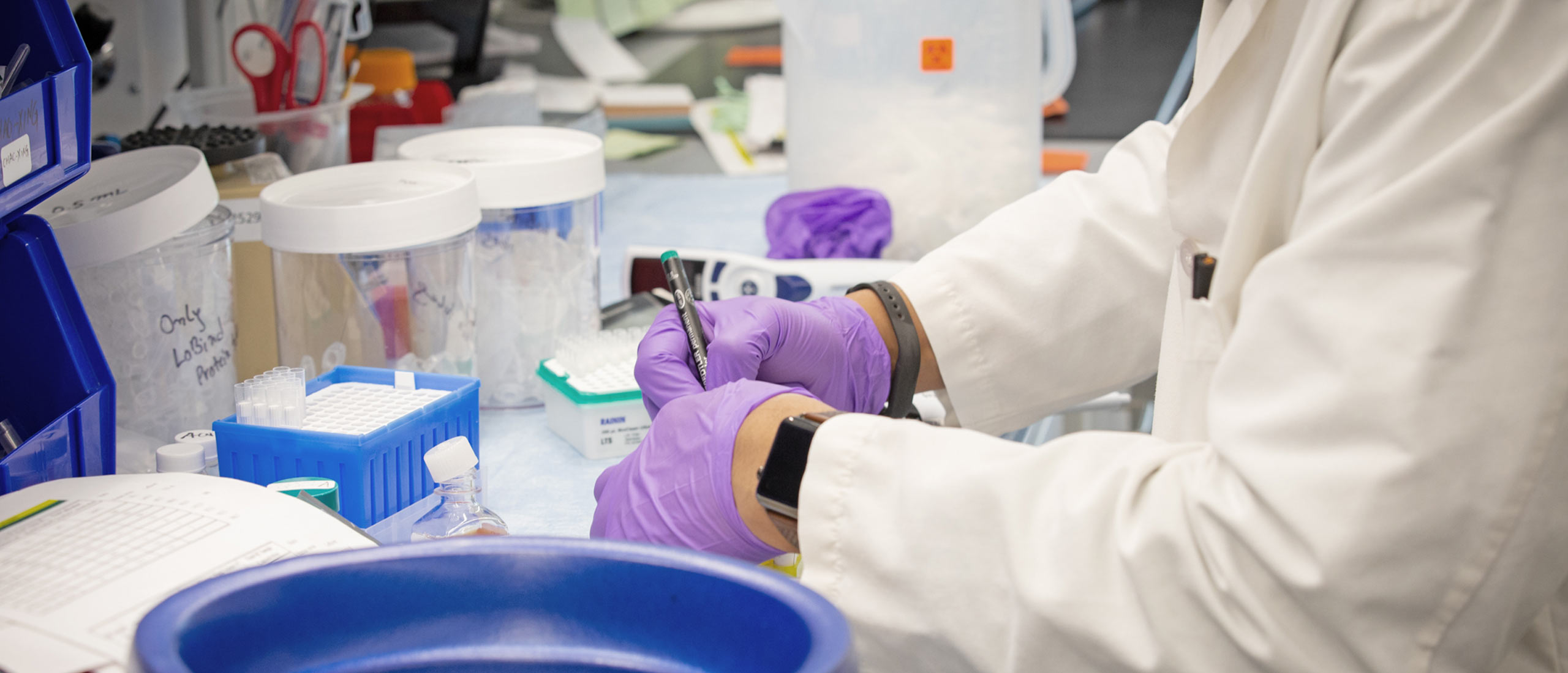 An Alexion employee working in a lab